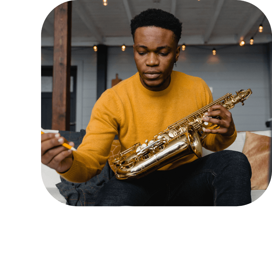 Artist working out a part on saxophone